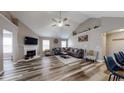 Spacious living room with vaulted ceilings, a fireplace, and luxury vinyl plank flooring at 4931 Wilkins Station Dr, Decatur, GA 30035