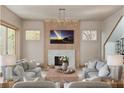 Bright living room with fireplace, mantle, modern lighting, and neutral decor at 125 Spring Dr, Roswell, GA 30075