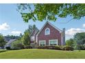 Charming brick two-story home with a well-kept lawn and mature trees at 2268 Orleans Ave, Marietta, GA 30062