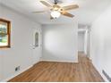 Bright living room featuring hardwood floors, a ceiling fan, and large windows at 3031 Walker Dr, Marietta, GA 30062