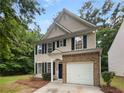 Inviting two-story home featuring classic architecture and a well-maintained front yard at 6240 Shenfield Ln, Union City, GA 30291