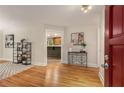 Bright entryway featuring hardwood floors, stylish console table, and an open view into the adjoining rooms at 2880 Foothill Trl, Marietta, GA 30066