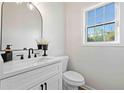 Clean, modern half bath with vanity, stylish mirror, and natural light at 139 Thunder Ridge Ln, Acworth, GA 30101