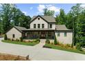 Beautiful two-story home with a brick exterior, inviting front porch, and well-maintained landscaping at 313 Anderwood Rdg, Marietta, GA 30064