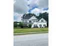 Beautifully landscaped two-story home with manicured lawn and a classic suburban appeal at 540 Langley Creek Dr, Loganville, GA 30052