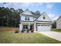 Charming two-story home featuring a well-manicured lawn, inviting front porch, and a two-car garage at 93 Oakdale Way, Temple, GA 30179