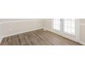 Elegant dining area with wood floors and access to the backyard at 4100 Summer Wood Dr, Snellville, GA 30039