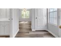 Bright entryway with light gray walls, and stylish flooring leading to an open-concept living space at 800 Tradd Ct, Stone Mountain, GA 30087