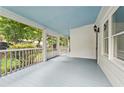 Spacious wrap around front porch featuring beautiful blue ceilings and floors at 240 Melrose Ave, Decatur, GA 30030