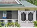 Elegant front porch with beautiful ornate screen doors and vintage house marker at 240 Melrose Ave, Decatur, GA 30030