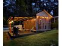 Cozy gazebo with outdoor dining area and grill, ideal for evening gatherings by the pool at 7234 Post Rd, Winston, GA 30187