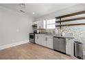 Modern kitchen features stainless steel appliances and ample cabinet space at 1057 Fortress Sw Ave, Atlanta, GA 30315