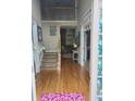 Inviting foyer with hardwood floors, staircase, high ceilings, and view into the living room at 3930 Regal Oaks Dr, Suwanee, GA 30024