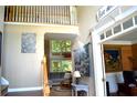 Bright foyer with soaring ceilings, hardwood floors, staircase, and view to the living room at 3930 Regal Oaks Dr, Suwanee, GA 30024