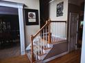Staircase with hardwood floors and carpeted steps leads to the second floor at 3930 Regal Oaks Dr, Suwanee, GA 30024