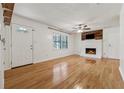 Spacious living room with hardwood floors and a cozy fireplace at 3123 Deshong Dr, Stone Mountain, GA 30087