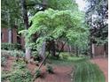 Lush green lawn with mature trees provides shade and enhances the tranquil atmosphere at 1131 Clairemont Ave # B, Decatur, GA 30030