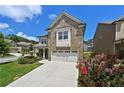 Charming two-story home with brick and siding exterior, well-manicured lawn and an attached two car garage at 2300 Ivy Birch Ln, Buford, GA 30519