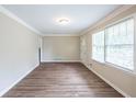 Bright living room featuring wood floors, large windows, and fresh paint at 3030 Golden Dr, Atlanta, GA 30344