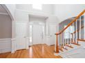 Bright foyer with hardwood floors, staircase, and tall ceilings creating an inviting entrance at 2625 Morningside Nw Trl, Kennesaw, GA 30144