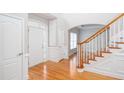 Inviting foyer with gleaming hardwood floors, staircase and white trim and an open design at 2625 Morningside Nw Trl, Kennesaw, GA 30144