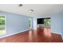 Inviting living room with hardwood floors, natural light and a view through to the dining room at 1553 Smithson Ct, Lithonia, GA 30058