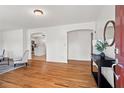 Inviting living room featuring hardwood floors, white walls, and an arched entryway at 365 Norcross St, Roswell, GA 30075