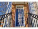 Stylish blue front door of home with brick exterior, railing, and visible house number at 401 Iona Abbey Ct # 6, Smyrna, GA 30082