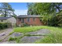 Large backyard with ample space and a brick exterior at 1143 Westview Sw Dr, Atlanta, GA 30310