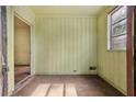 Cozy sunroom with paneled walls and plenty of natural light at 1143 Westview Sw Dr, Atlanta, GA 30310