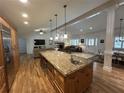 Modern kitchen with a large island, stainless steel appliances, and open living area at 2062 Valiant Ne Dr, Atlanta, GA 30345