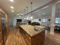 Gourmet kitchen island featuring pendant lighting, granite countertops, and stainless steel appliances at 2062 Valiant Ne Dr, Atlanta, GA 30345