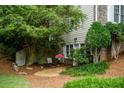 Secluded backyard retreat with gravel area and lush landscaping at 3788 Westwick Nw Ct, Kennesaw, GA 30152