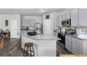 Stylish kitchen with granite counters, stainless appliances, and a large island at 9122 Golfview Cir, Covington, GA 30014