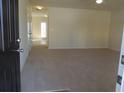 Inviting living room featuring neutral carpet, ample natural light, and smooth walls at 515 Brady Dr, Villa Rica, GA 30180