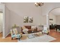 Inviting living room with high ceilings, hardwood floors, and neutral paint at 845 Melbourne Trl, Alpharetta, GA 30009