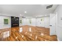 Spacious living room with hardwood floors and an elegant electric fireplace at 2798 Hutchins Rd, Lawrenceville, GA 30044