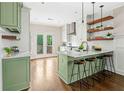 Stylish kitchen with an island, marble countertops, modern appliances and bar stool seating at 34 Montgomery Se St, Atlanta, GA 30317