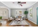 Bright living room featuring hardwood floors, modern furniture, and plenty of natural light at 34 Montgomery Se St, Atlanta, GA 30317