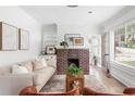 Bright living room featuring a fireplace, neutral decor, and hardwood floors at 462 Kendrick Se Ave, Atlanta, GA 30315