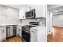 Modern kitchen featuring stainless steel appliances and marble backsplash at 1150 Rankin St # 6H, Stone Mountain, GA 30083