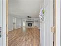 View from the front door into an open living room with a fireplace and wood floors at 120 Lakeside Dr, Ellenwood, GA 30294