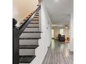 Elegant staircase with modern black railings, seamlessly connecting the home's levels at 4417 Village Square Ln, Stone Mountain, GA 30083