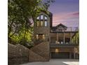 Stunning elevation of brick home with multi-level decks and grand staircase, complemented by a convenient garage at 1260 Monroe Ne Dr, Atlanta, GA 30306