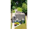 Aerial view of the home with a private backyard, patio, fire pit and lush landscaping at 2545 Tilson Se Dr, Atlanta, GA 30317