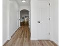 Bright entryway featuring sleek hardwood floors, fresh white paint, and a view to additional rooms at 2130 Executive Dr, Duluth, GA 30096