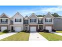 Attractive townhouses featuring brick accents, attached garages and well-maintained landscaping at 5696 Union Pointe Dr, Union City, GA 30291