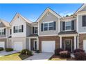 Charming townhouse with a brick front and attached one-car garage, nestled in a desirable community at 5696 Union Pointe Dr, Union City, GA 30291