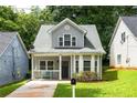 Well-maintained two-story home with inviting curb appeal and neatly landscaped yard at 1296 Plaza Sw Ave, Atlanta, GA 30310