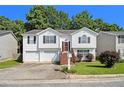 Charming split-level home with a well-maintained lawn, inviting stairs, and an attached two-car garage at 3372 Springside Rdg, Decatur, GA 30034